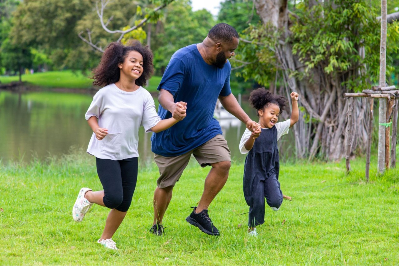 dad engaging in physical activity with kids